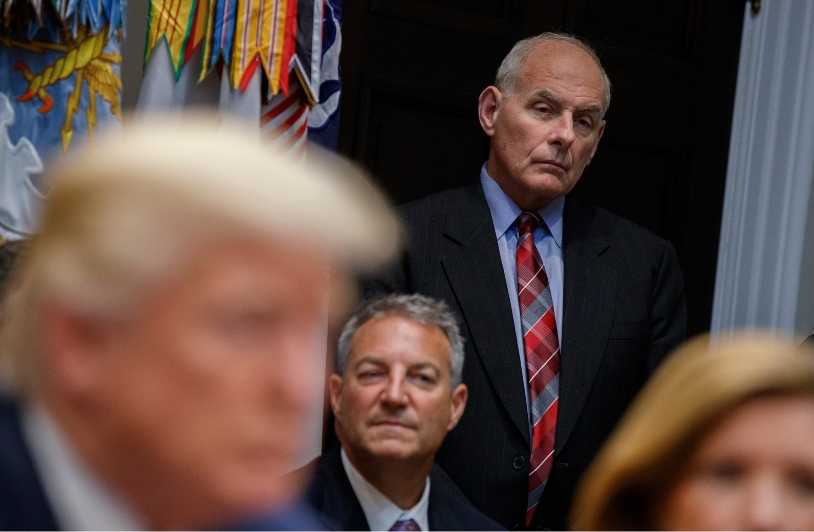 John F. Kelly with Trump in foreground