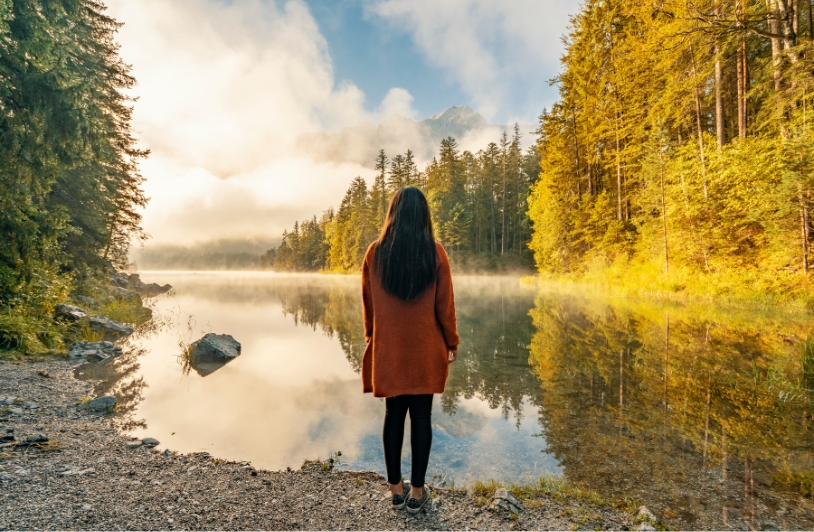 woman looking at lake ecology